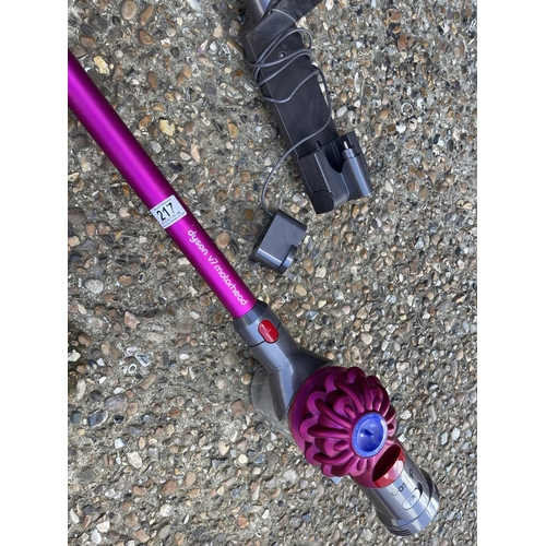 217 - Pink cordless dyson cleaner with charger and wall mount