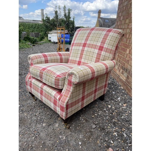 23 - A red and white chequered pattern armchair