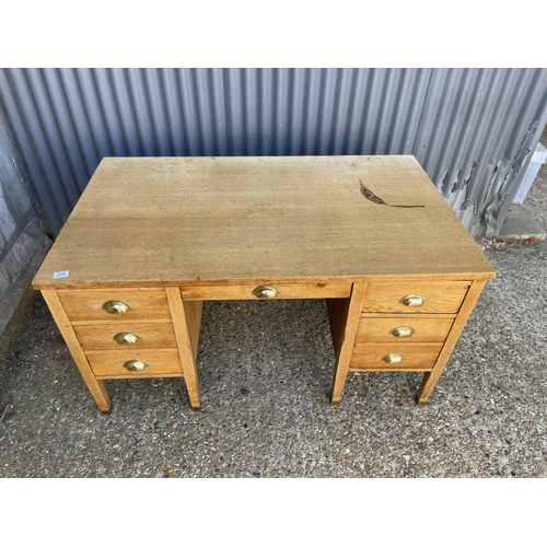 254 - An early 20th century oak twin pedestal desk