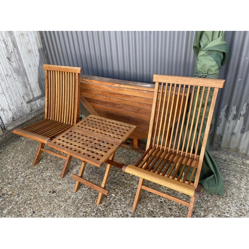 270 - A hardwood drop leaf garden table together with two folding chairs and a folding drinks table