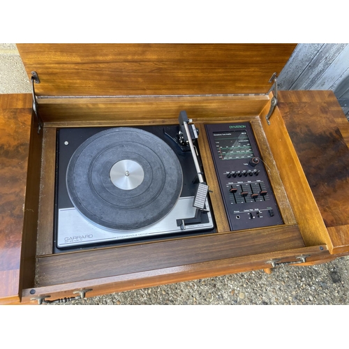 272 - A yew wood cased DYNATRON radiogram / record player with garrard deck