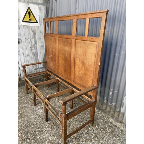 275 - An arts and crafts oak three seater settle bench with high panel back with inlaid squares 152cm wide... 