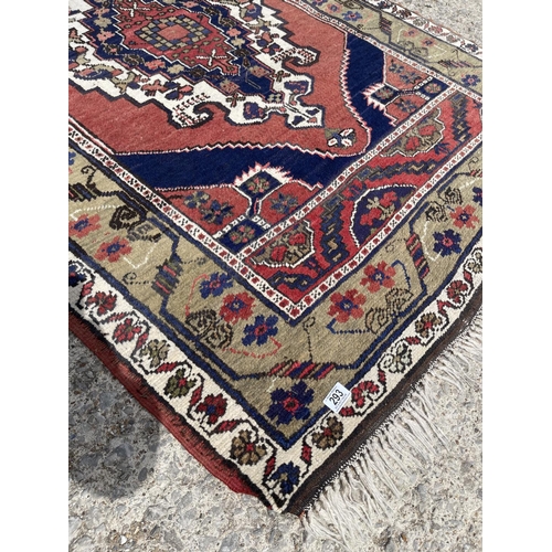 293 - A red oriental pattern carpet 125x180