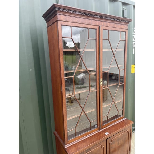 298 - A victorian mahogany two door cabinet on two door cupboard base  92x50x207