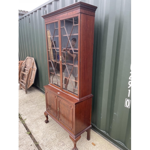 298 - A victorian mahogany two door cabinet on two door cupboard base  92x50x207