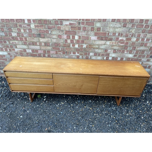 3 - A mid century teak cocktail sideboard by White & Newton