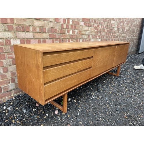 3 - A mid century teak cocktail sideboard by White & Newton