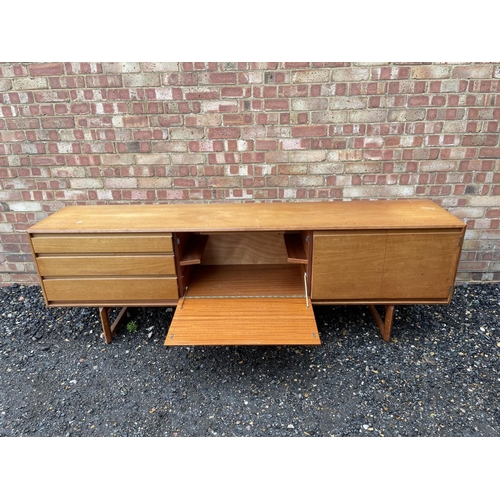 3 - A mid century teak cocktail sideboard by White & Newton