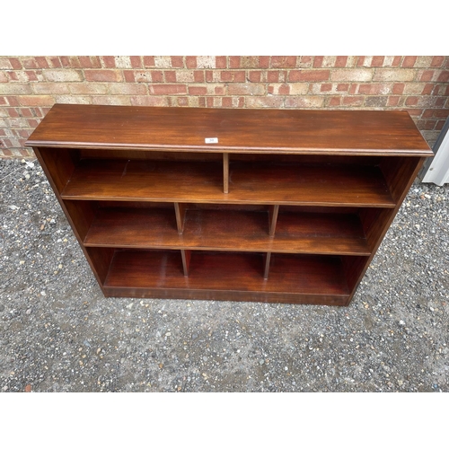 30 - A mahogany open fronted bookcase