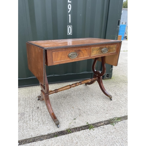 301 - A reproduction mahogany sofa table