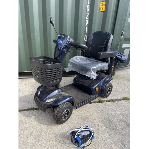 306 - An INVACARE LEO  mobility scooter with key, charger, and rain cover  in working order