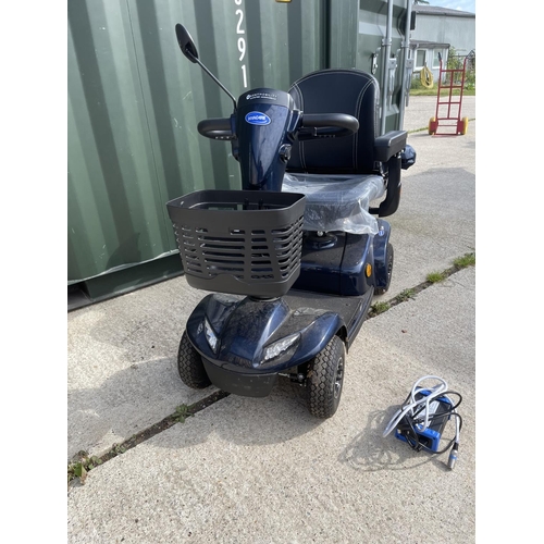 306 - An INVACARE LEO  mobility scooter with key, charger, and rain cover  in working order