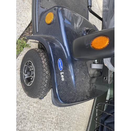 306 - An INVACARE LEO  mobility scooter with key, charger, and rain cover  in working order