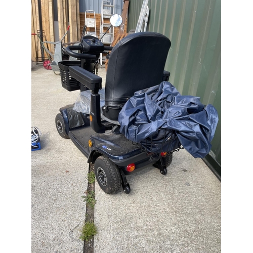 306 - An INVACARE LEO  mobility scooter with key, charger, and rain cover  in working order