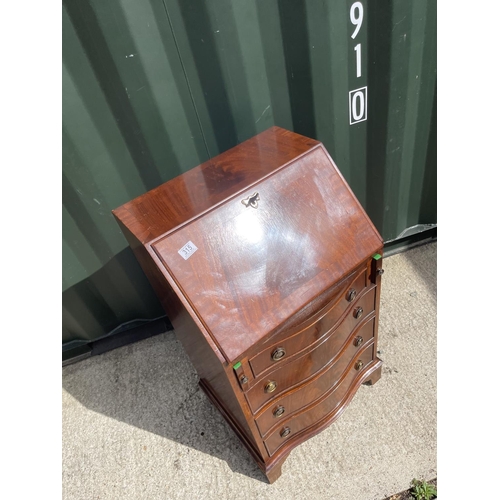 315 - A reproduction mahogany serpentine front bureau