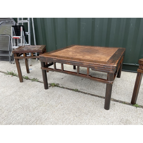 328 - A large oriental style hardwood coffee table 90x90 together with two matching lamp tables