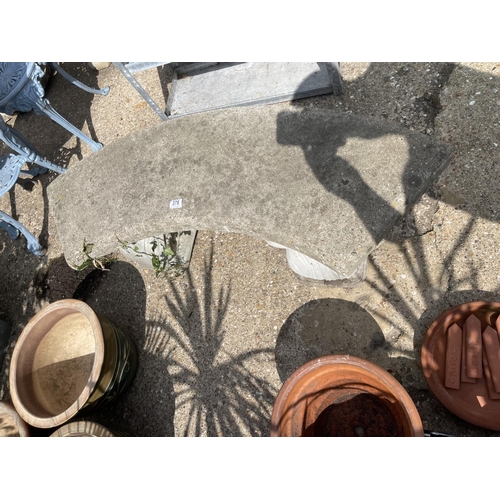 378 - A curved concrete garden bench seat