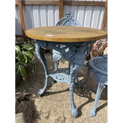 379 - A Britannia style circular garden table with two chairs, painted blue