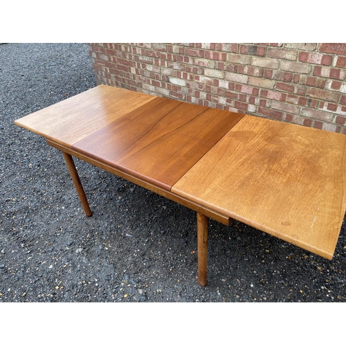 4 - A mid century teak extending dining table by White and Newton