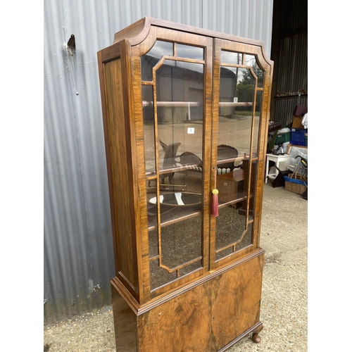 6 - A Queen Anne style walnut cabinet with glazed top over two cupboard base 86x28x191