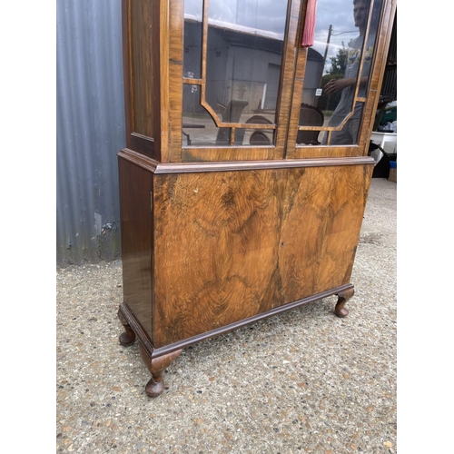 6 - A Queen Anne style walnut cabinet with glazed top over two cupboard base 86x28x191