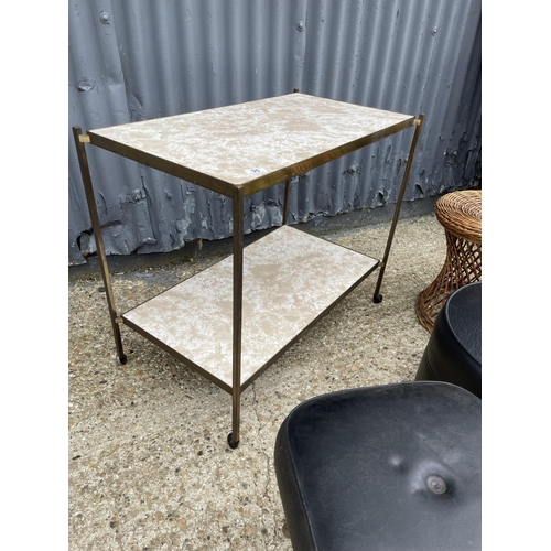 90 - A mid century brass tea trolley together with two poof and wicker stand