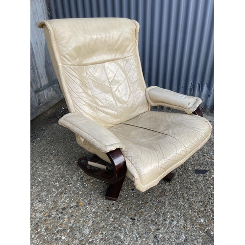 107 - A mid century Norwegian swivel and recliner leather chair with stool (leather AF)