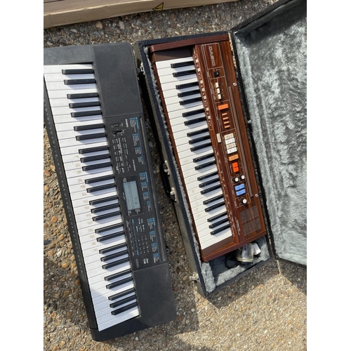 123 - Two Casio keyboards and two folding stands