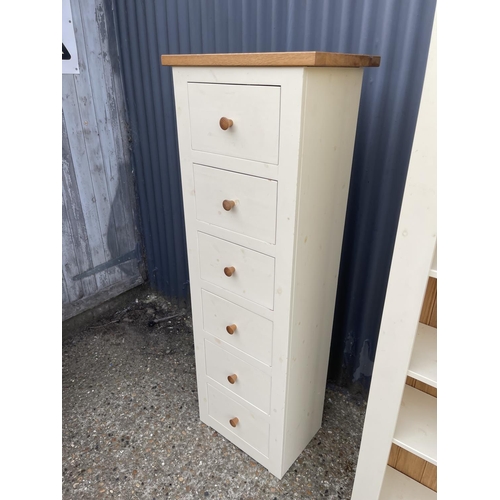 125 - A modern painted pine tallboy chest of six together matching open bookcase