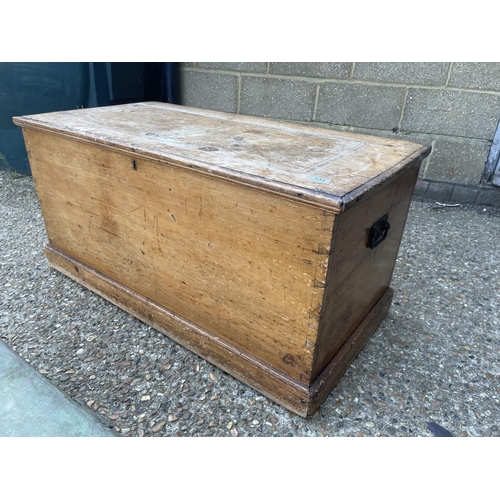 131 - A large pine blanket box together with a smaller green painted pine tool chest