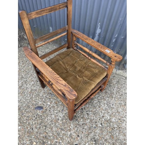 139 - An oak bed chair with folding back