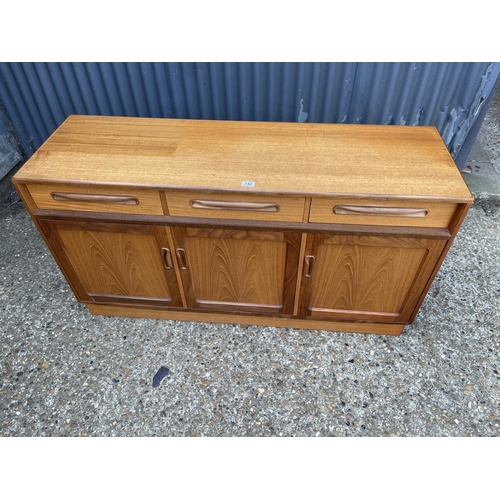 142 - A mid century g plan fresco sideboard with three drawers and three cupboard