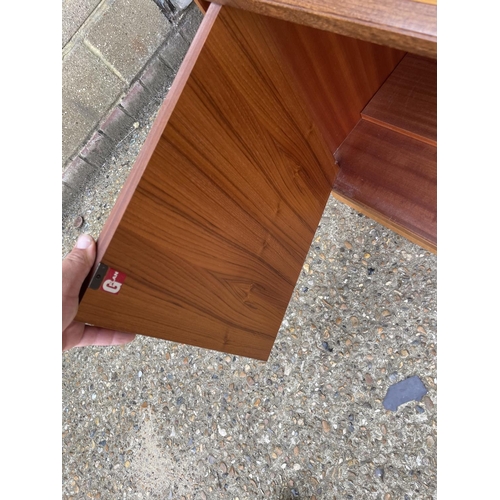 142 - A mid century g plan fresco sideboard with three drawers and three cupboard