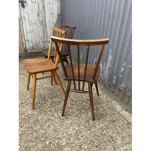 143 - Three Ercol stick back chairs