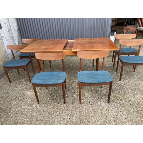 146 - A g plan teak extending dining table together with six teak chairs (possibly kofod Larsen unmarked)