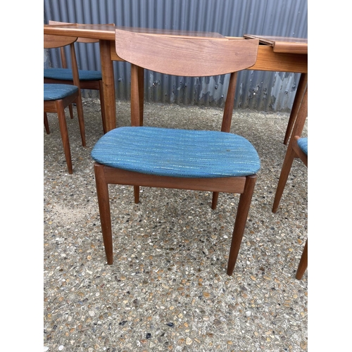 146 - A g plan teak extending dining table together with six teak chairs (possibly kofod Larsen unmarked)