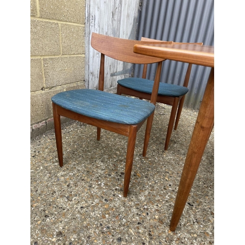 146 - A g plan teak extending dining table together with six teak chairs (possibly kofod Larsen unmarked)