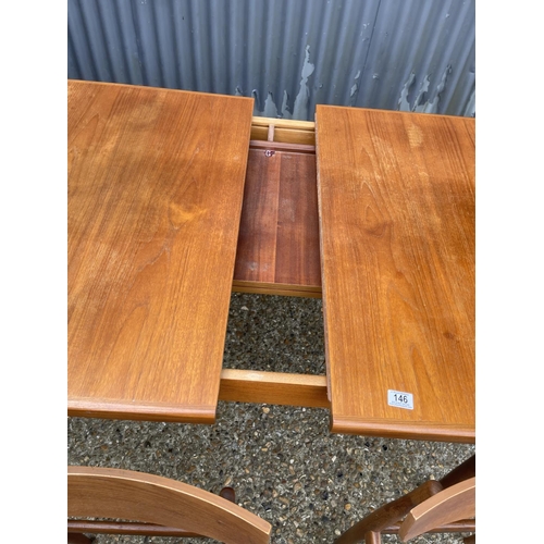 146 - A g plan teak extending dining table together with six teak chairs (possibly kofod Larsen unmarked)