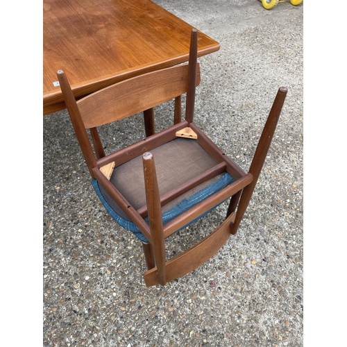 146 - A g plan teak extending dining table together with six teak chairs (possibly kofod Larsen unmarked)