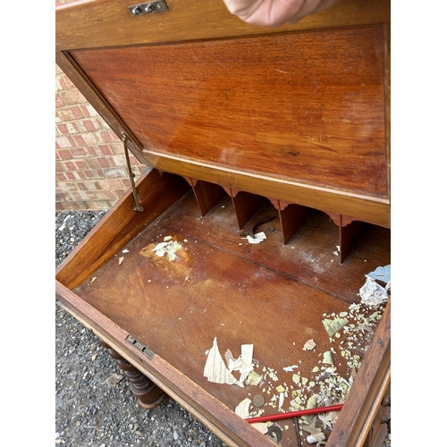 15 - A wide Victorian mahogany davenport desk with four drawers and four dummy drawers  73x60x77