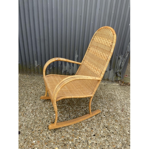 150 - A mid century rattan rocker chair