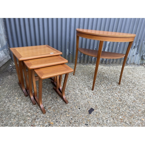 158 - A mid century teak nest of three together with a hall table