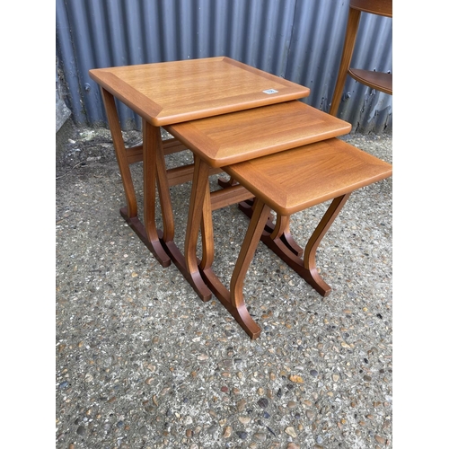 158 - A mid century teak nest of three together with a hall table