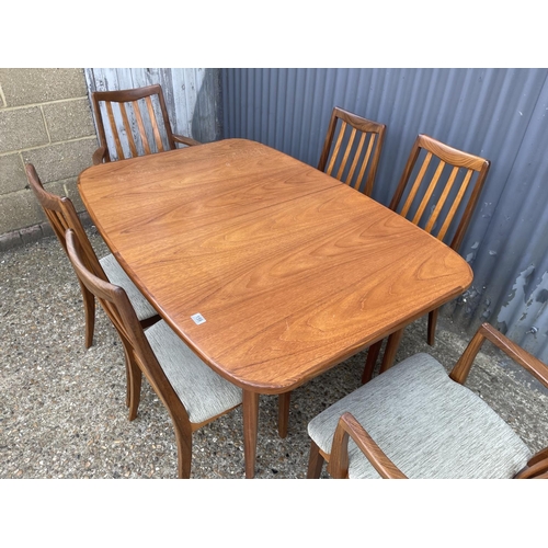 159 - A g plan teak extending dining table together with a set of six g plan teak dining chairs including ... 