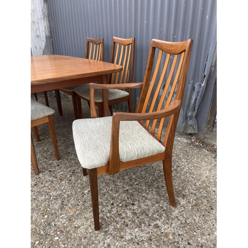 159 - A g plan teak extending dining table together with a set of six g plan teak dining chairs including ... 