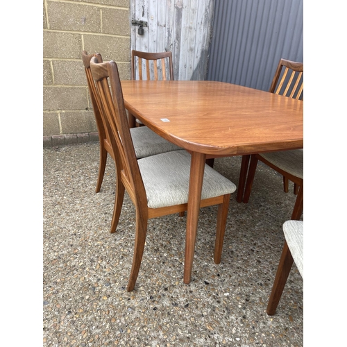 159 - A g plan teak extending dining table together with a set of six g plan teak dining chairs including ... 