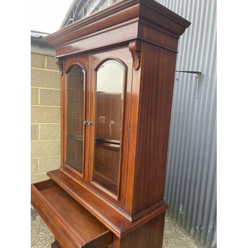 169 - A reproduction mahogany bookcase cupboard  110x50x208