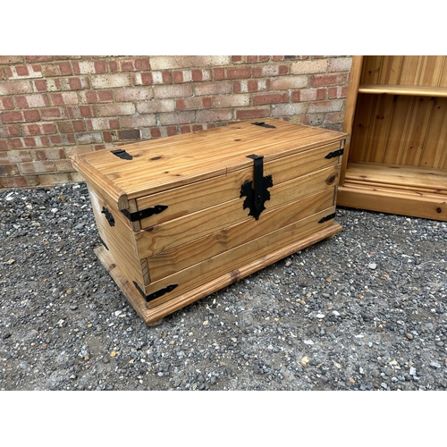 18 - A modern open fronted pine bookcase together with a pine blanket box chest