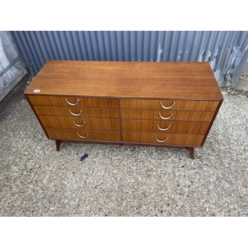 183 - A mid century austin suite chest of 8 drawers 132x46x70