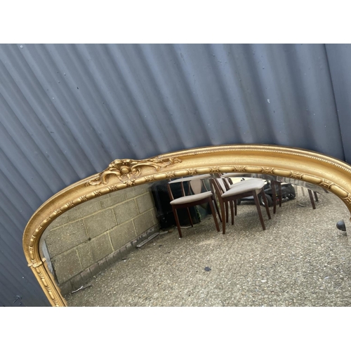 187 - A large gold gilt overmantel mirror 135x87